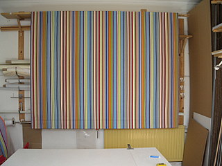 Large blind made in a colourful striped John Lewis fabric
